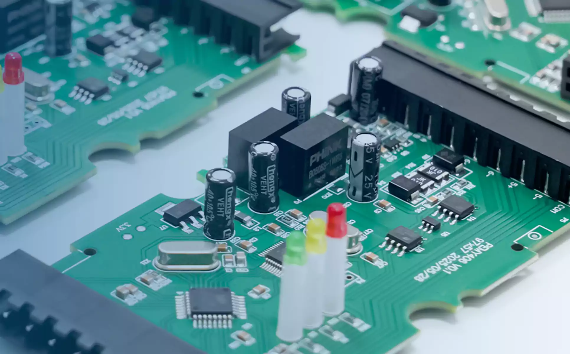measuring a supply rail while following PCBA board debugging steps
