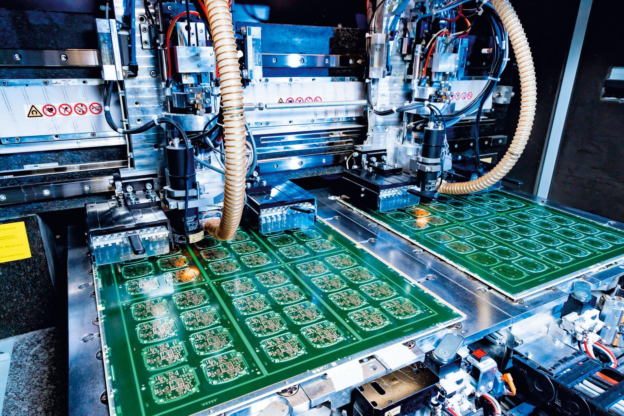 Automated SMT line assembling the circuit boards described in this guide